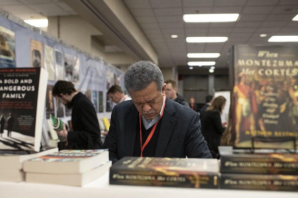 Browsing books in the Exhibit Hall. 